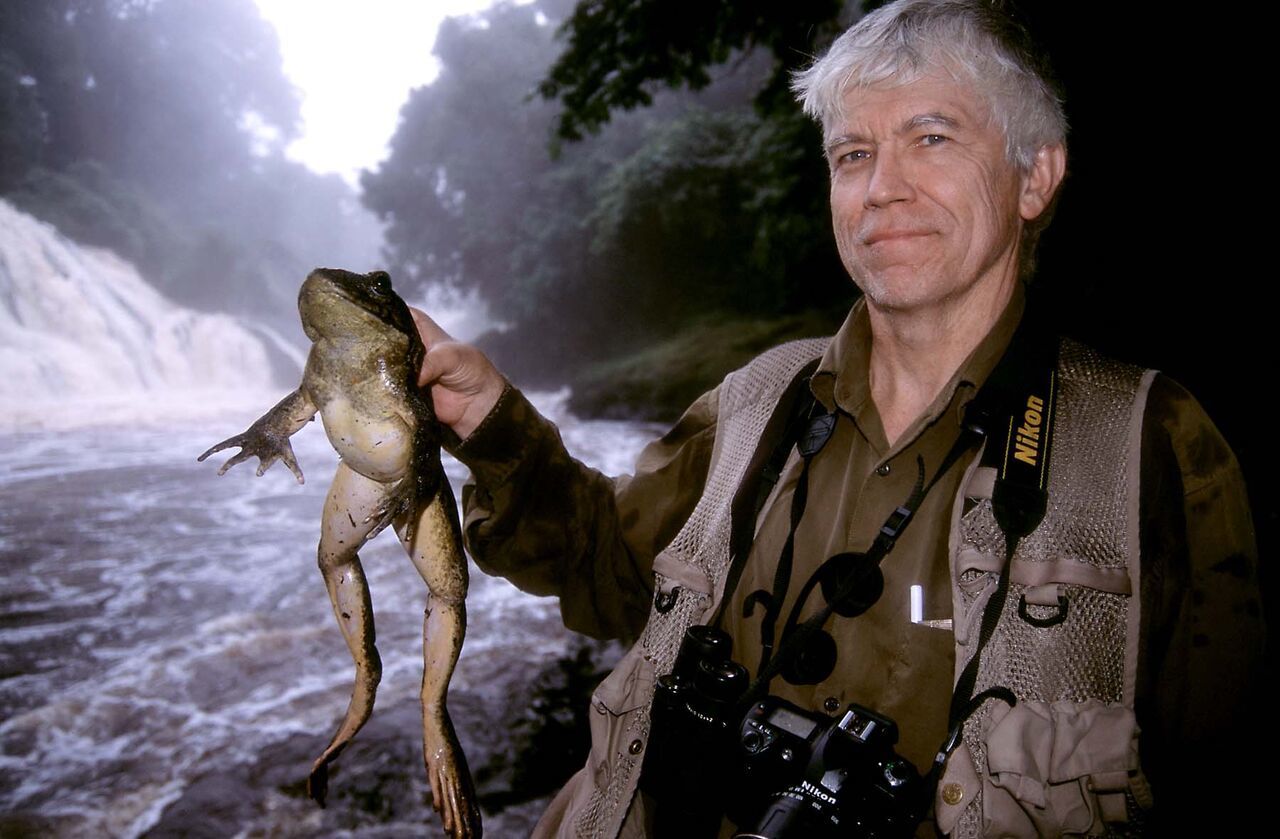 Russ Mittermeier with friend in the field